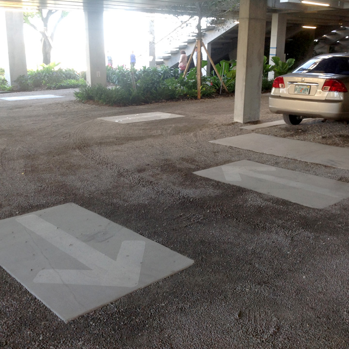 Painted directional arrows on concrete in Gravelpave2